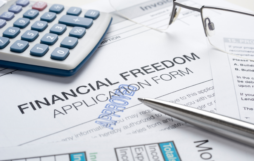 Financial freedom concept with apporoved application pen and calculator